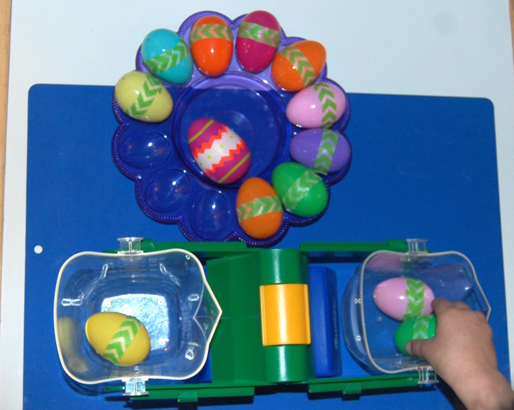 Easter Projects for Preschoolers - Scale weighing plastic eggs 