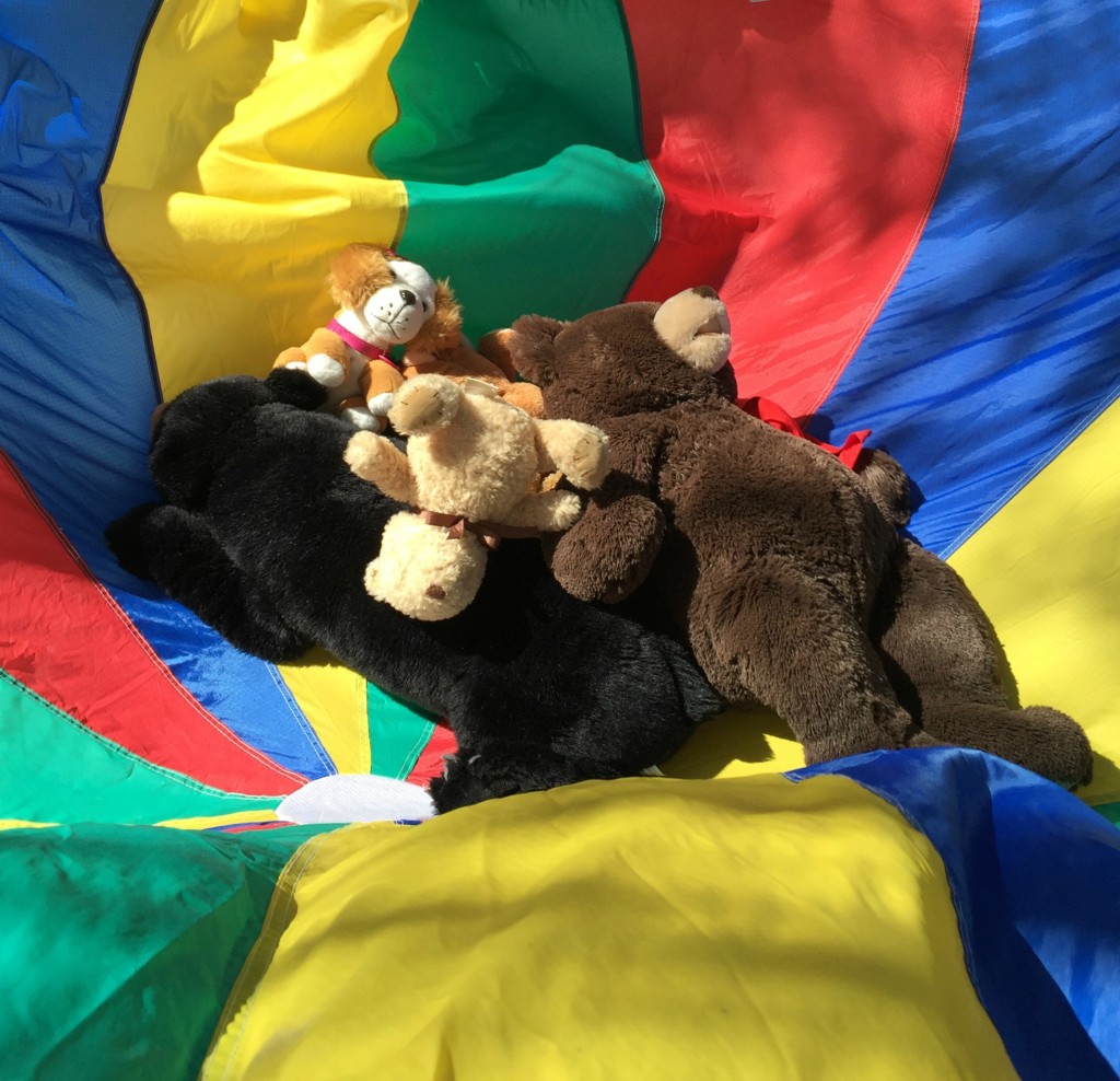 Teddy Bear Day activities for Preschoolers - Teddy Bears getting bounced in the parachute