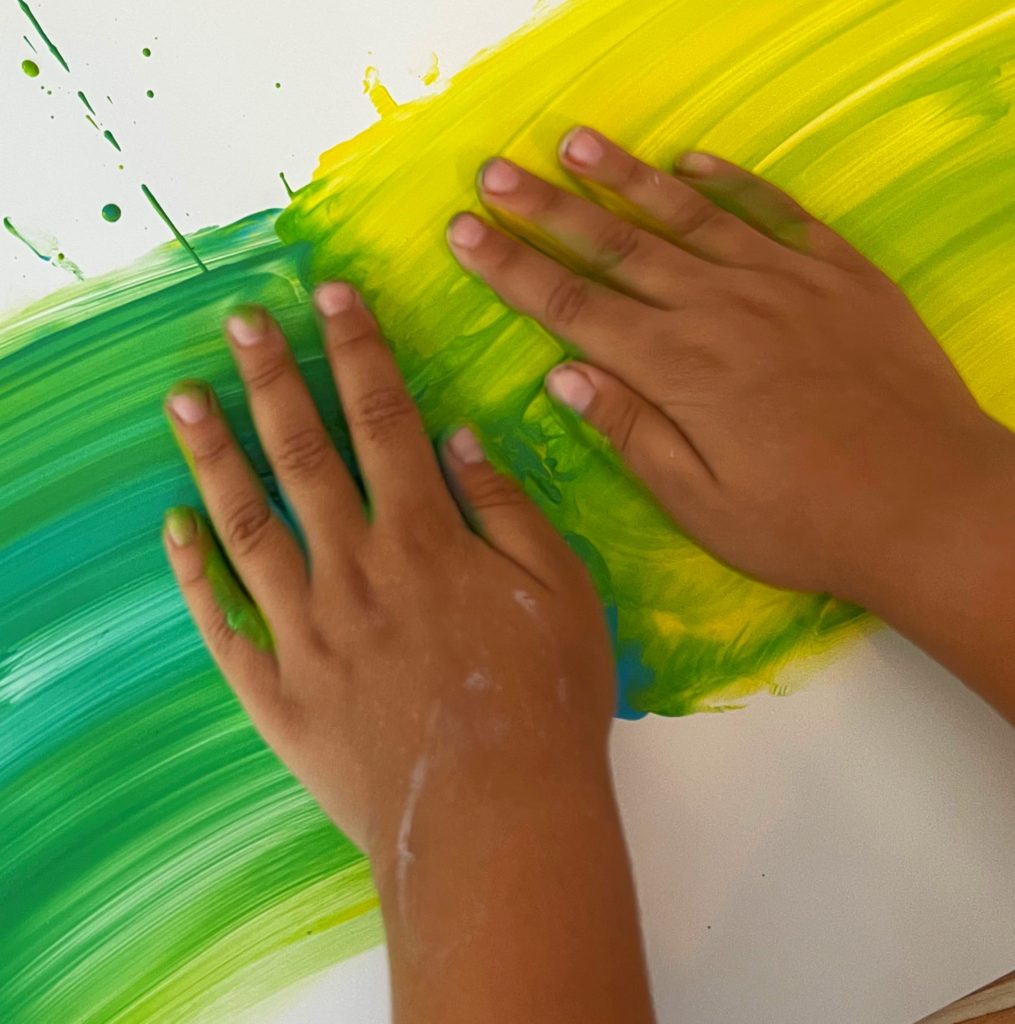 Finger painting and color mixing the first week of preschool 