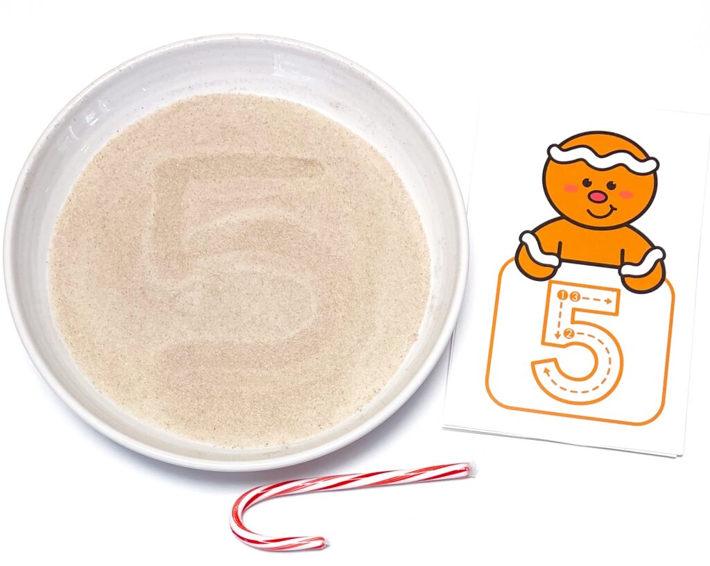 Gingerbread Writing Preschool Activity Number Formation Posters with cinnamon and sugar writing tray and candy cane 